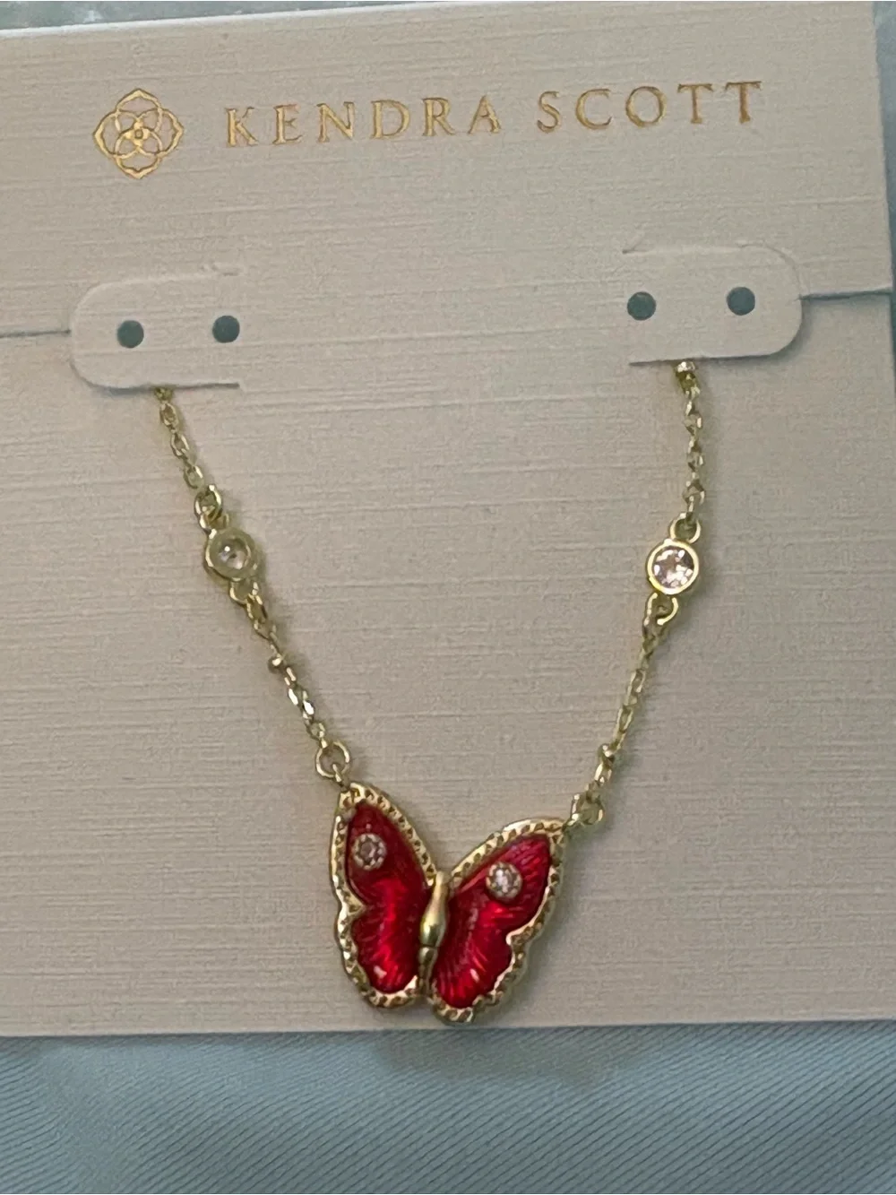 Kendra Scott Gold Necklace with Red Butterfly Pendant and Crystal Accents